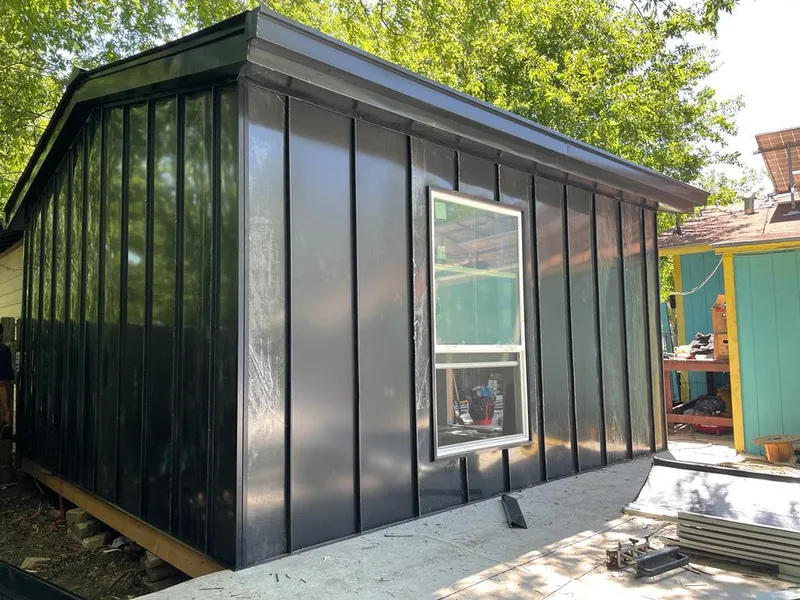 Black standing seam metal wall panels for Roof Inspection in Brent